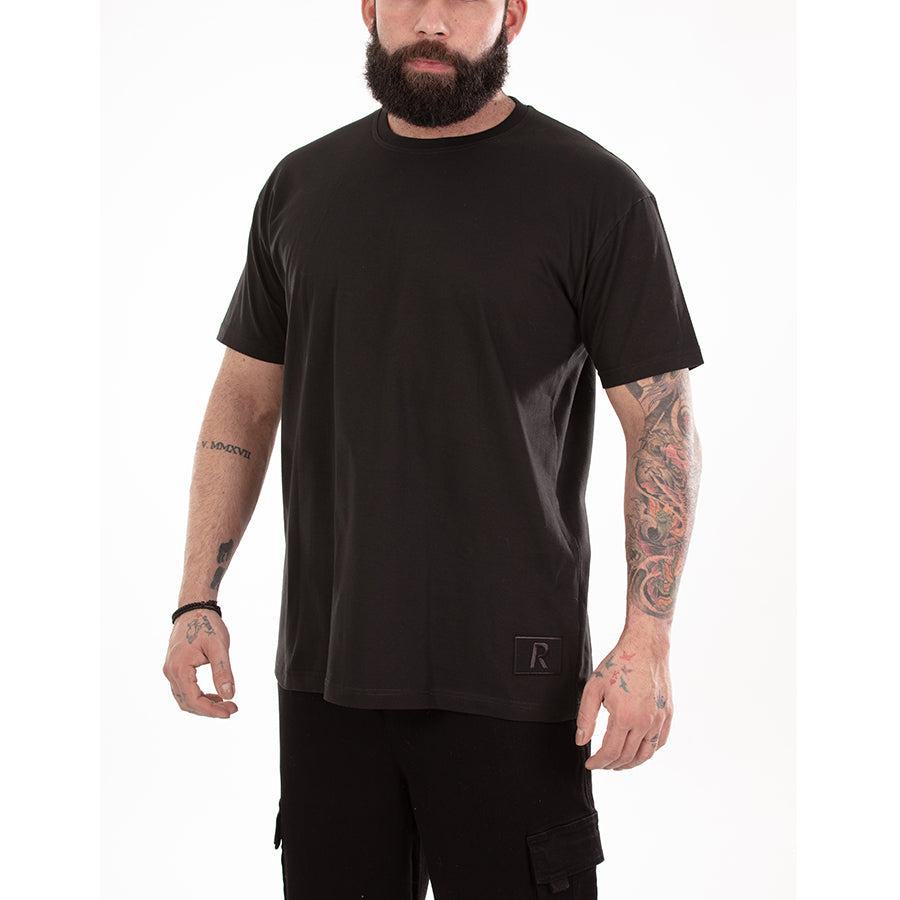 Front of White T-shirt with RangeTrotter "R" logo patch on bottom left